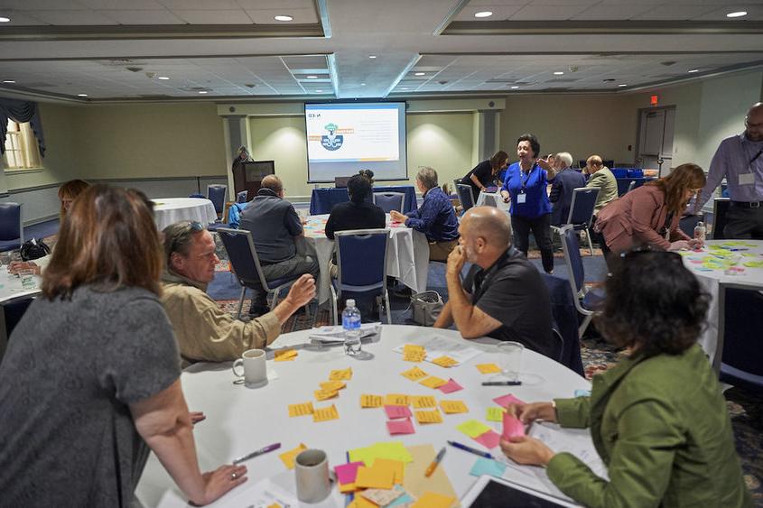 Group of people sitting around a table during workshop